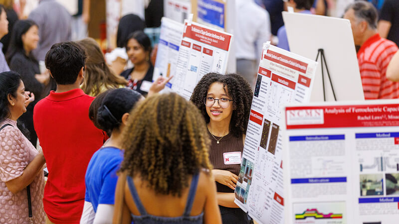 Students discuss work at Research Fair