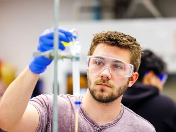 Student conducting experiment in a lab
