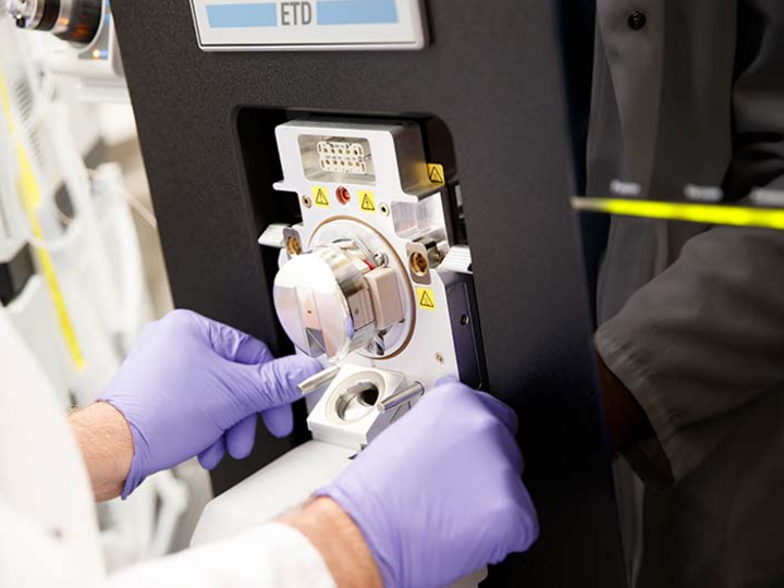 scientist working with a machine in the lab