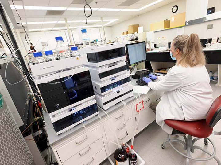 scientist working with data on the computer in the lab